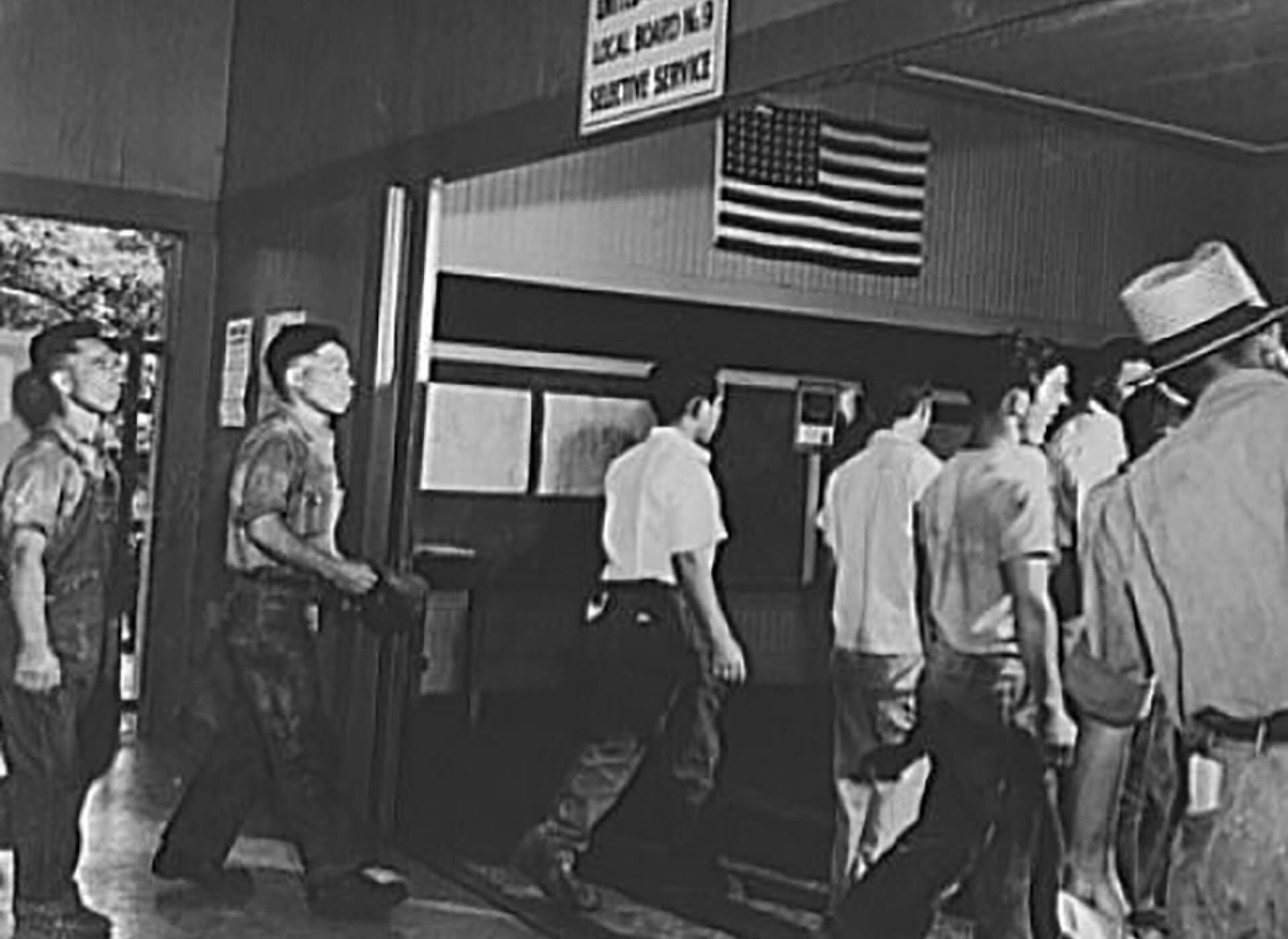 Group of men arriving at a Selective Service office.