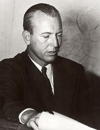 Black and white photo of man in suit - Police Captain John A. Burns